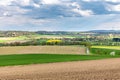 Beautiful spring landscape with green meadows, the sky with picturesque clouds