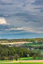 Beautiful spring landscape with green meadows, the sky with picturesque clouds Royalty Free Stock Photo
