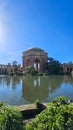 A beautiful spring landscape at Palace of Fine Arts with a lake, lush green trees and plants and beautiful buildings with blue sky Royalty Free Stock Photo
