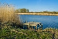 Beautiful spring landscape, river, reeds and a bridge Royalty Free Stock Photo
