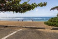 a beautiful spring landscape at Sandy Beach with blue ocean water, silky brown sand, people relaxing, palm trees in Honolulu Royalty Free Stock Photo