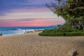 a beautiful spring landscape at Sandy Beach with blue ocean water, silky brown sand, people relaxing, palm trees in Honolulu Royalty Free Stock Photo