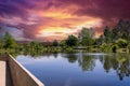 a beautiful spring landscape in the Sculpture Garden at New Orleans City Park with a lake, lush green trees, grass and plants Royalty Free Stock Photo