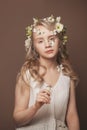 Beautiful spring model woman in flowers and summer butterfly. Nude makeup, curly blonde hair. Fashion, Cosmetics and Perfumes Royalty Free Stock Photo