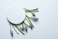 Beautiful spring muscari flowers and card on light background, flat lay. Royalty Free Stock Photo