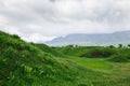 Beautiful spring and summer landscape. Lush green hills, high mountains. Kyrgyzstan Background for tourism Royalty Free Stock Photo