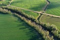 Beautiful spring time farmland landscape with river and gravel road, aerial Royalty Free Stock Photo