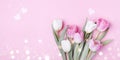 Beautiful spring tulip flowers on pastel pink table top view. Greeting banner for International Women Day, Mother day. Flat lay Royalty Free Stock Photo