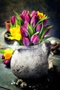 Beautiful spring tulips bouquet, easter eggs and garden tools Royalty Free Stock Photo