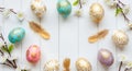 Gold ornate Easter eggs and feathers on white wood Royalty Free Stock Photo
