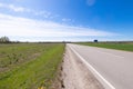 A beautiful springtime scenery with asphalt road in Latvia.