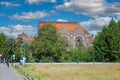 Beautiful square park with skyline of dutch city, blue summer sky fluffy whiteclouds Royalty Free Stock Photo