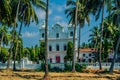 Beautiful St. Alex Church and palm trees in Saligao, India