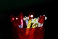 Candles Stack with Red and White Objects Photograph