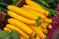 Stacked yellow squash at farmers' market