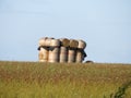 Beautiful stacked straw bullets creating an artistic figure in the field Royalty Free Stock Photo