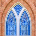 Beautiful stained glass window of a brick building Royalty Free Stock Photo