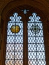 Beautiful stained glass window with symbols of sun and rose
