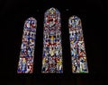 Beautiful stained glass windows in church. Ancient cathedral decoration. Colorful stained glass windows on dark background.