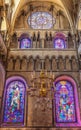 Beautiful stained glass windows and hanging chandelier inside Canterbury cathedral in Canterbury,