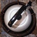 beautiful stainless kettle on a round gas stove seen from above