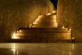 Beautiful stair steps with yellow light in the night time in a hotel on a dark background