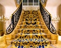 Beautiful staircase with wrought iron railings Royalty Free Stock Photo