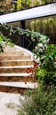 Beautiful stairway decorated with beautiful flowers, green leave, vine and creeper tree for background