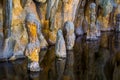 Beautiful stalagmite stones in the water of a drip stone cave, nature underground scenery Royalty Free Stock Photo