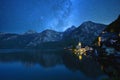 The starry view at Hallstatt mountain village in the Austrian Alps at beautiful night in autumn season ,Salzkammergut region, Royalty Free Stock Photo