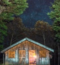 Beautiful starry sky behind a beautiful cabin in one of the mountains of Latin America