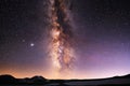 Beautiful starry sky with mountais silhouete, milky way galaxy. Night landscape. Astronomical background.