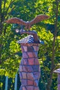 Beautiful statue of a metal eagle on a stone fireplace in the house