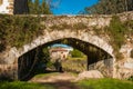 Lierganes, Cantabria, Spain. 05-25-2019. Roman bridge and Monument to the Man Fish. Monumento al hombre Pez. River Miera. Mytholo