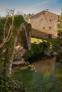 Lierganes, Cantabria, Spain. 05-25-2019. Roman bridge and Monument to the Man Fish. Monumento al hombre Pez. River Miera. Mytholo