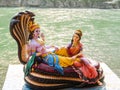 Beautiful statues of Lord Vishnu and Lakshmi at the Ganga riverbank in Rishikesh