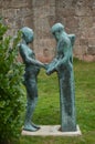 Beautiful Statute of a Monk and a Woman in the Gardens of the Monastery of San Millan de La Cogolla on a Very Cloudy Day. Architec