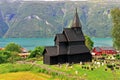 Beautiful stave church on fjords at Ornes Royalty Free Stock Photo