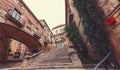 Beautiful steps and archway of the Pujada de Sant Domenec located in the Jewish Quarter of Girona, Spain Royalty Free Stock Photo