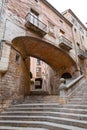 Beautiful steps and archway of the Pujada de Sant Domenec located in the Jewish Quarter of Girona, Spain Royalty Free Stock Photo