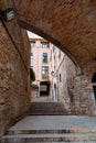 Beautiful steps and archway of the Pujada de Sant Domenec located in the Jewish Quarter of Girona, Spain Royalty Free Stock Photo