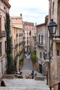 Beautiful steps and archway of the Pujada de Sant Domenec located in the Jewish Quarter of Girona, Spain Royalty Free Stock Photo