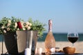 Beautiful still life flowers glass of wine champagne and fruits in background sea Royalty Free Stock Photo