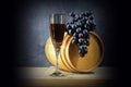 Beautiful still life with glass of red wine against background of oak wine barrel with red wine Royalty Free Stock Photo