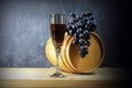 Beautiful still life with glass of red wine against background of oak wine barrel with red wine Royalty Free Stock Photo