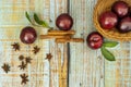 A small bamboo wooden bowl filled with large ripe yellow plums Royalty Free Stock Photo