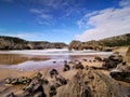 Beautiful stone arches on Playa de las Cuevas del Mar, Cantabria, Spain