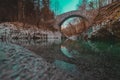 Beautiful stone bridge on Nadige river in enchanted forest Royalty Free Stock Photo