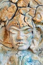 Beautiful stone face sculpture with a closed eyes Royalty Free Stock Photo