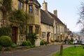 Stone houses of a quaint street in the Cotswolds village of Burford, England